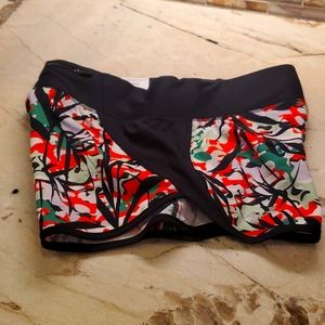Woman's running short, black & multi. Zipper pouch in back. sm/p. Never worn
